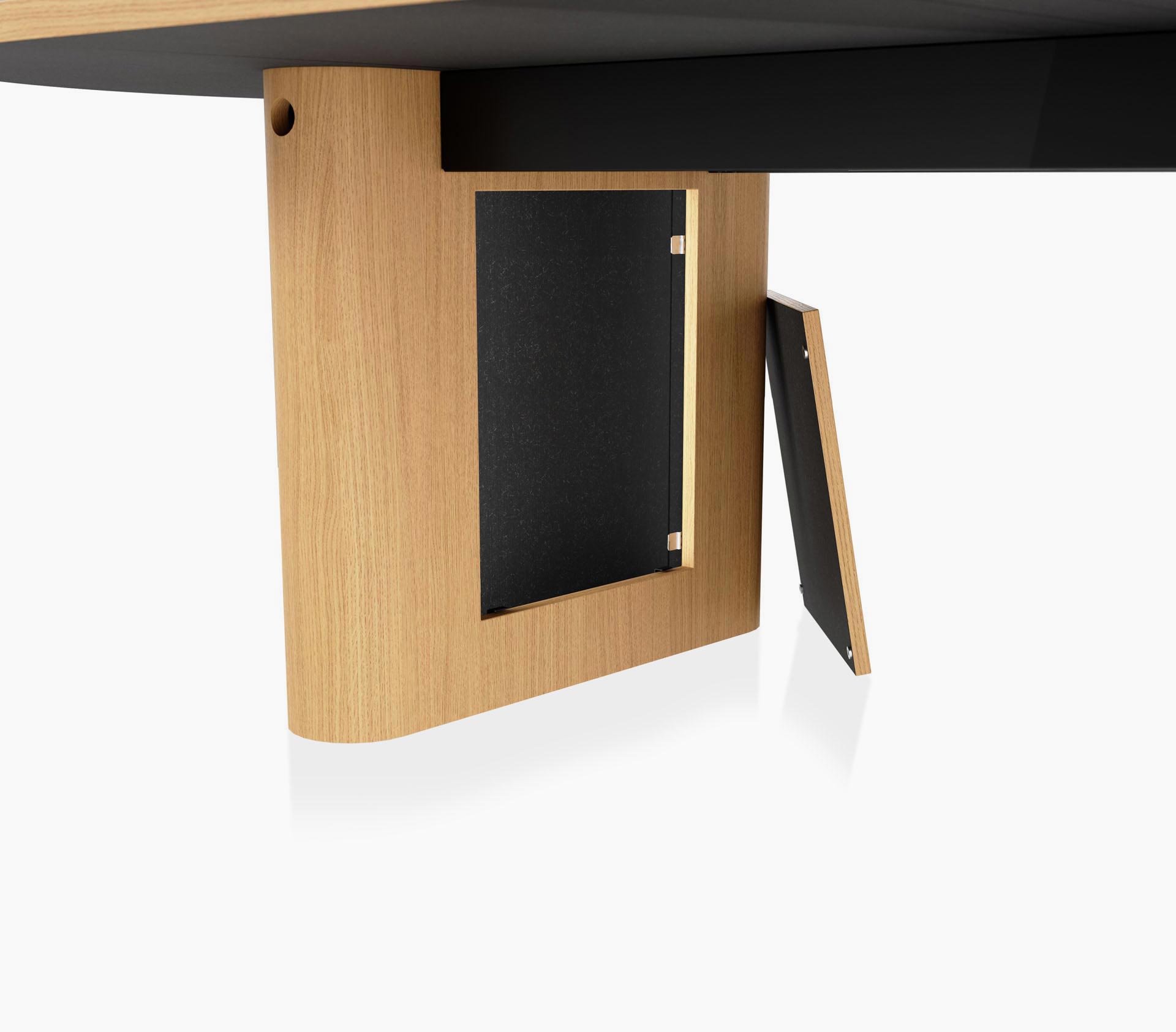 Open wire management leg detail on a JD Conference Table in natural rift cut oak with a racetrack-shaped base
