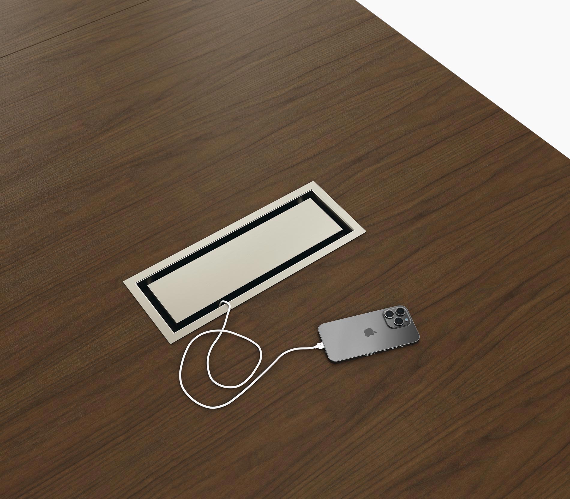 Tabletop power access on a Highline Conference Table in cashmere flat cut walnut with satin nickel details