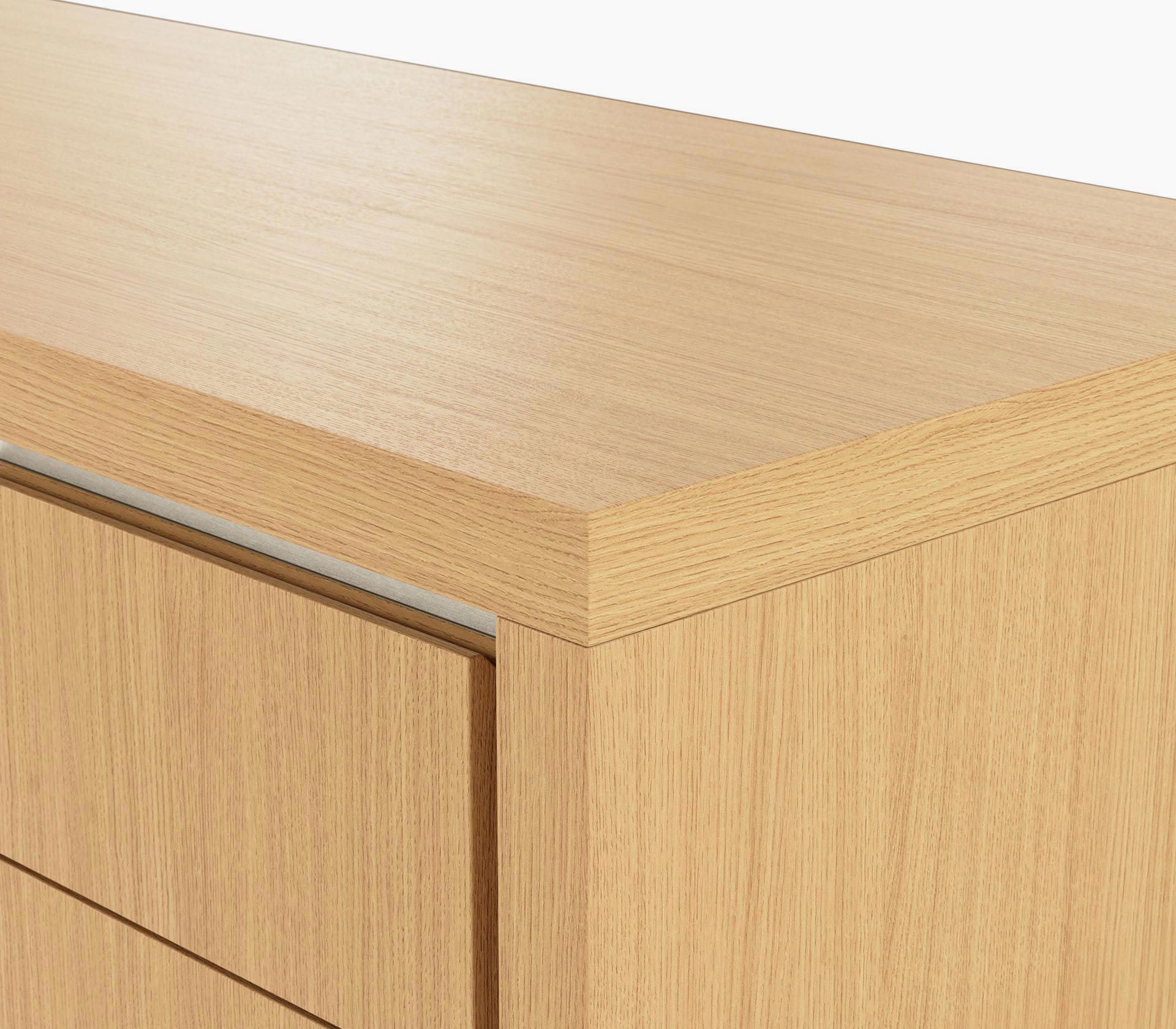 Edge detail on a Highline Fifty Credenza in natural rift cut oak with a satin nickel trim