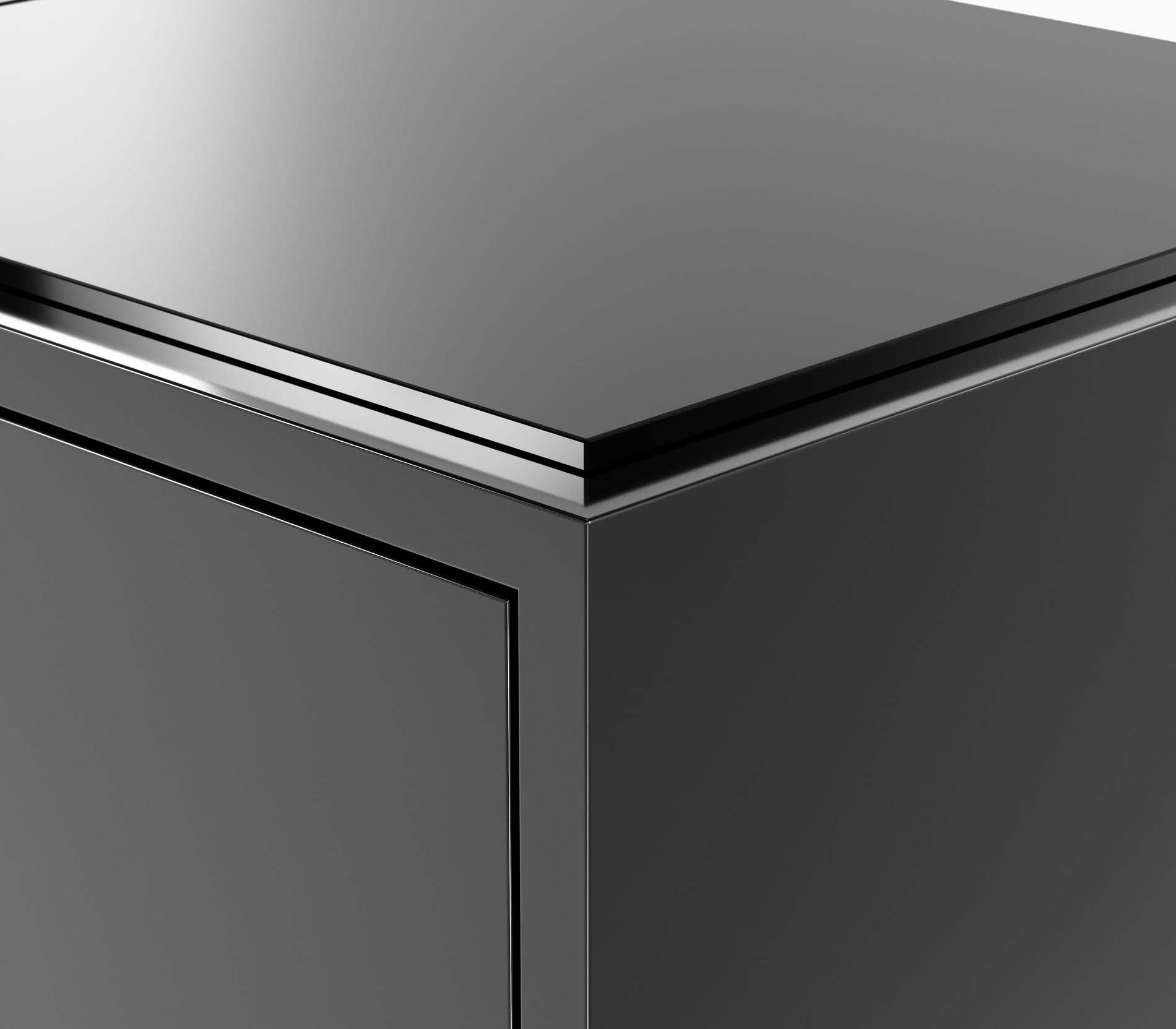 Edge detail of a Highline Credenza in black polyester with a clear black back painted glass top