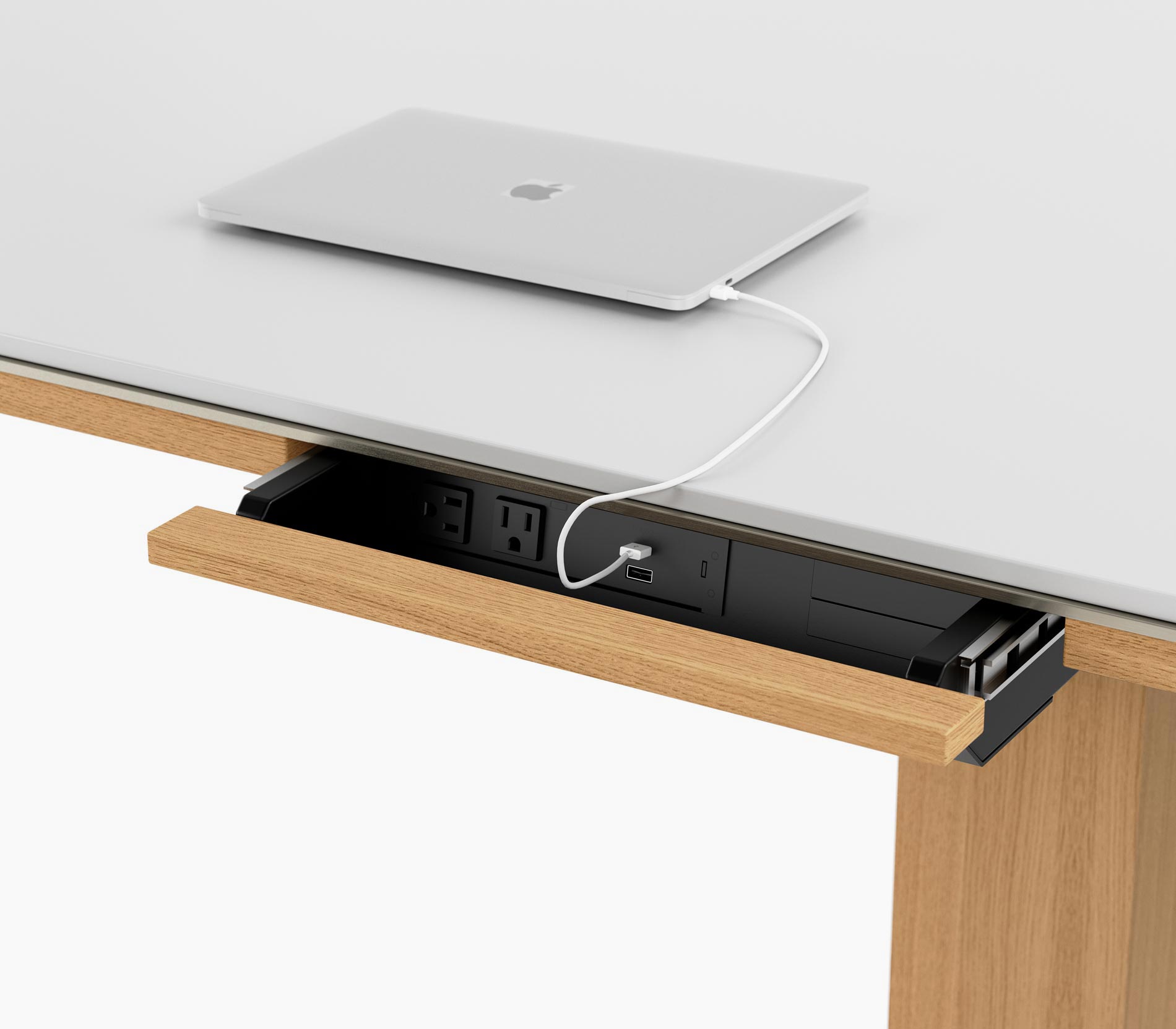 Open power drawer on a Highline Fifty Conference Table in glacier white corian and natural rift cut oak, viewed from an angle