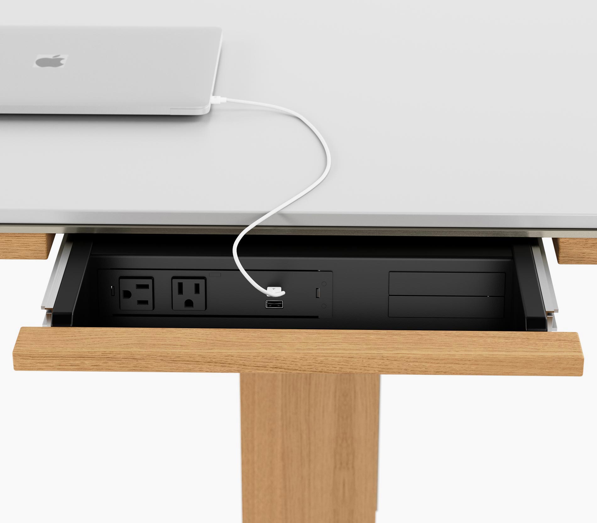 Open power drawer on a Highline Fifty Conference Table in glacier white corian and natural rift cut oak, viewed from the front