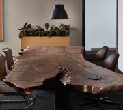 Live edge conference table with walnut slab top and custom cantilever base, under mount technology access 